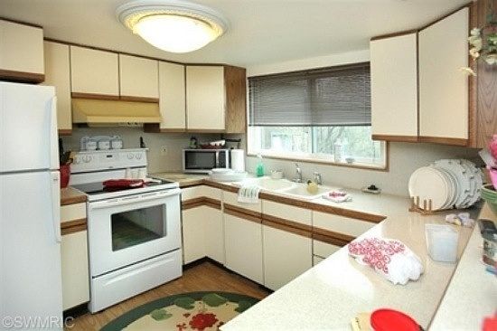 The kitchen is small and efficient, with several lazy susans