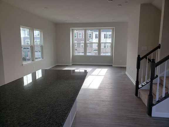 living room area view from kitchen with bay window