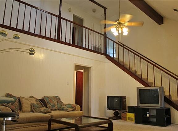 Living area with over looking stair case.