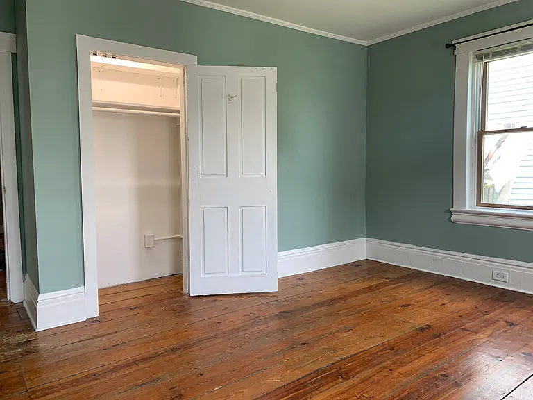 Bedroom 1, well-lit closet with two shelves