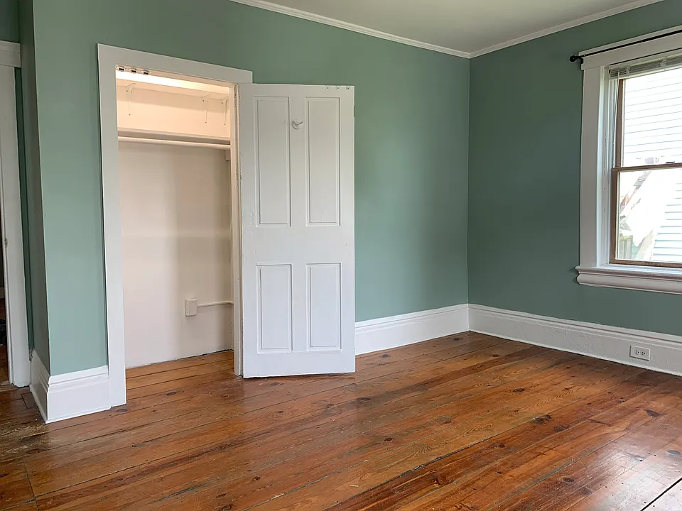 Bedroom 1, well-lit closet with two shelves