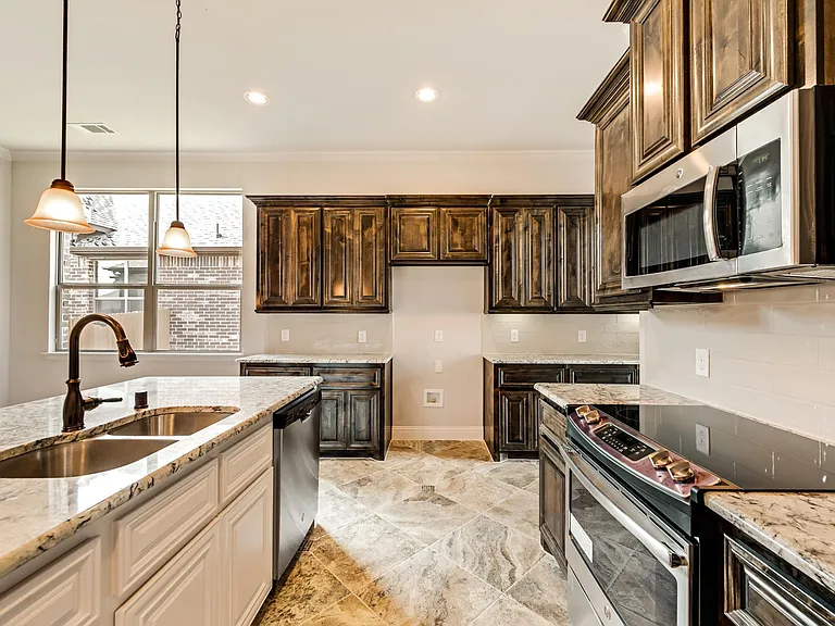 Kitchen with granite and tiled back splash