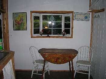 Bay window above Tulip stenciled table.