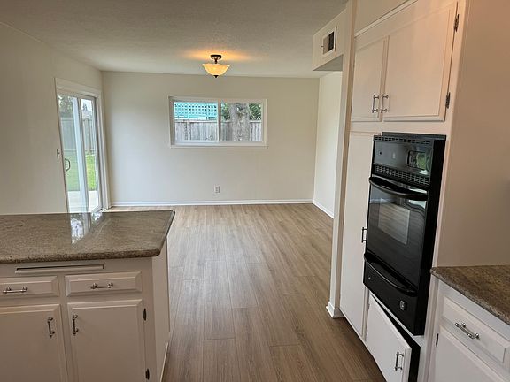 View of family room off the kitchen and slider out to the backyard.