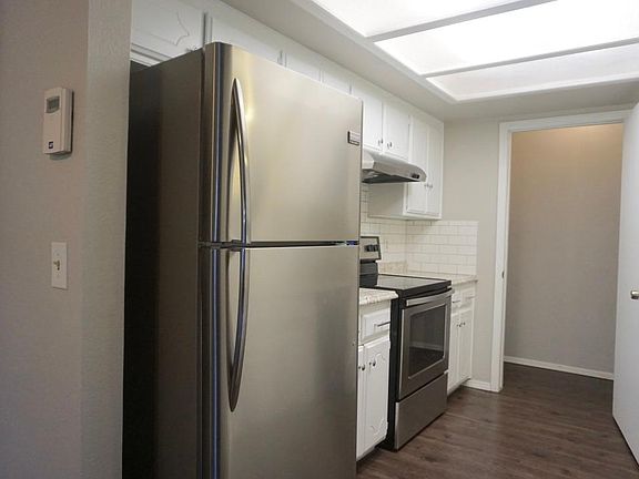 Stainless steel appliances and beautiful vinyl plank floor - optional alarm system already installed just needs service