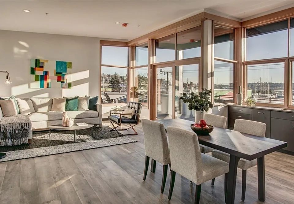 Living room + kitchen views + access to private balcony