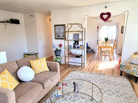 Living room looking into dining room and kitchen