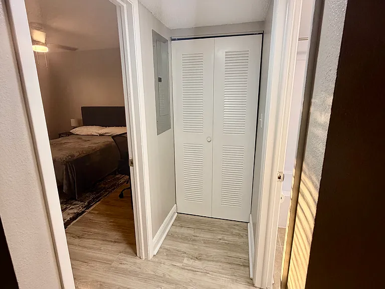 Hallway leading to second bedroom and second bathroom.