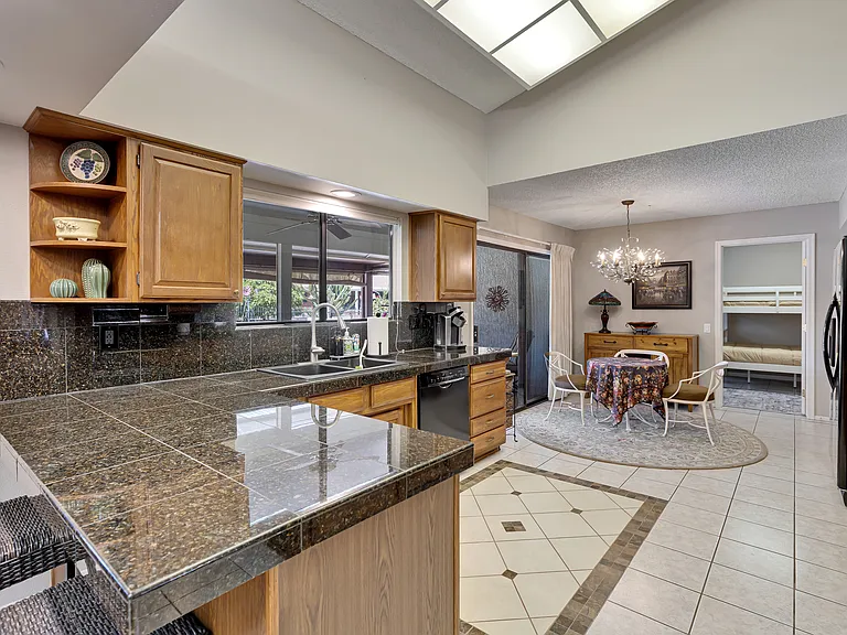 Kitchen and Breakfast nook that leads into multipurpose room