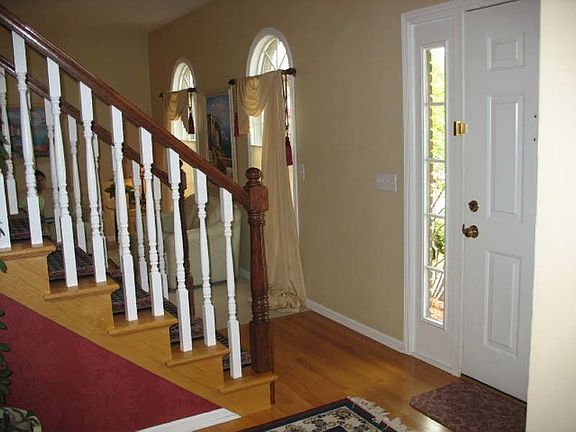 Formal foyer with hardwood floor