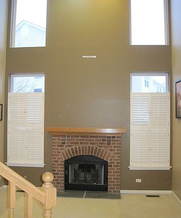 Two story living room w/fireplace.