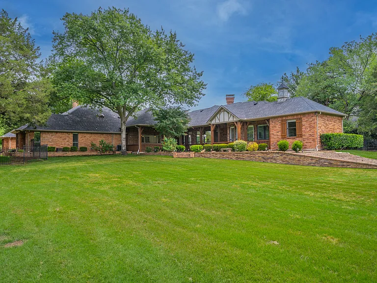 Architectural Charm: Brick Exterior with Winding Concrete Path