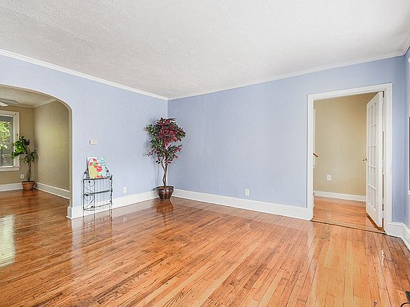 Living Room is open to Dining Room and Stairwell with Second Full Main Level Bathroom.