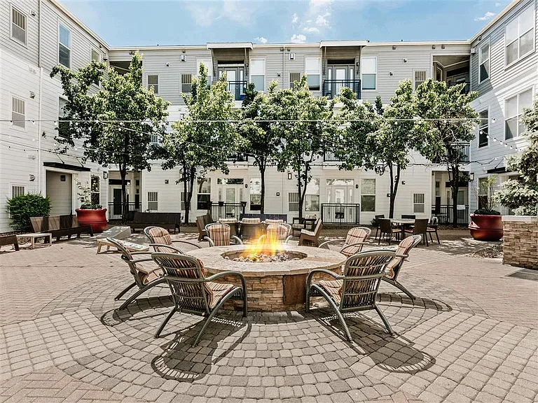 Courtyard firepit surrounded by cozy seating