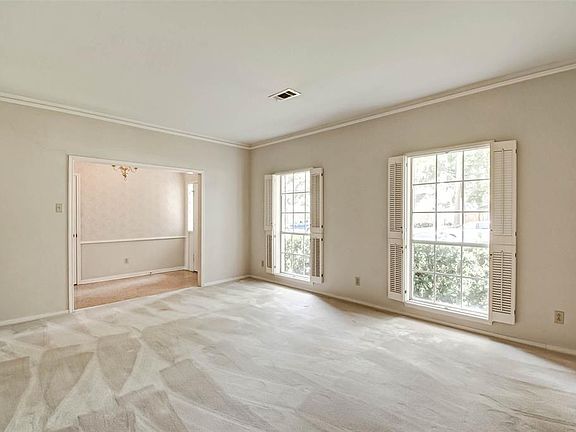 Formal Living off of entry filled with natural light.