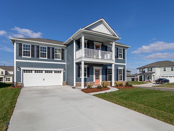 Foxfield Exterior 5 w siding, shakes, brick, double front porch deck and 2 car garage