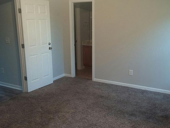 Master bedroom suite with double vanities and walk in closet