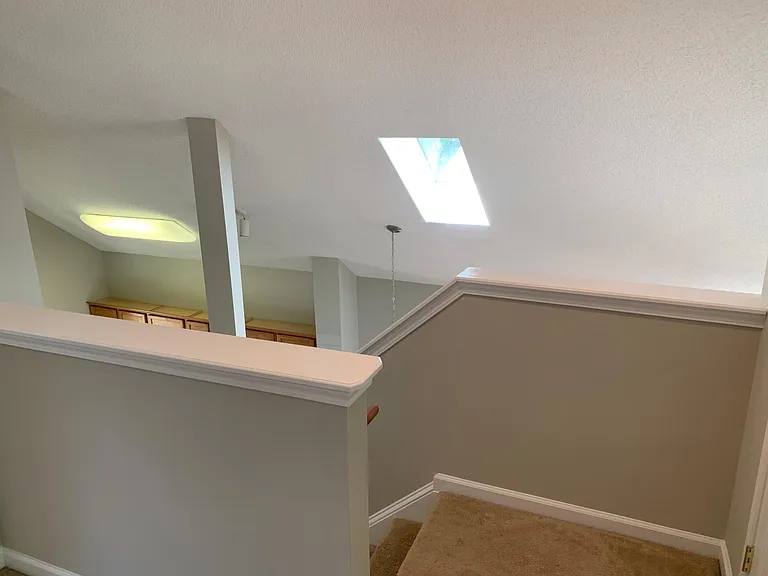 top of stairs over looking living room