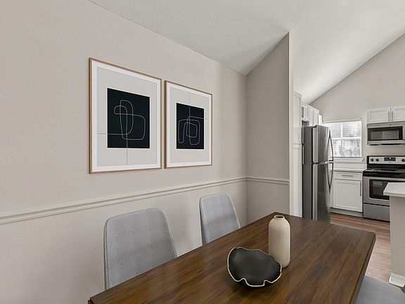 Experience the perfect blend of style and functionality in this open dining and kitchen space.