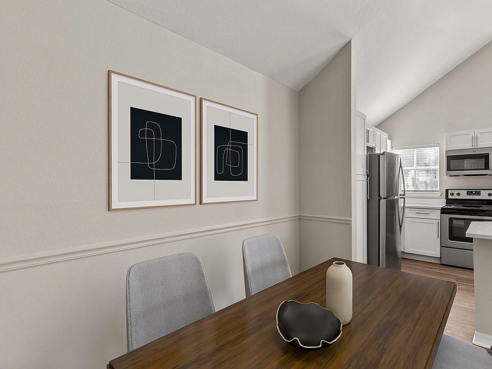 Experience the perfect blend of style and functionality in this open dining and kitchen space.