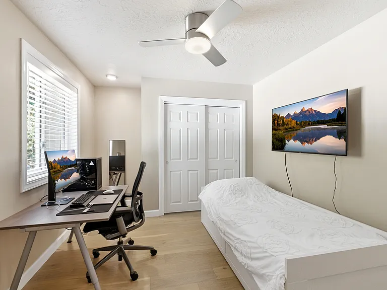 Bright second-floor bedroom with ample closet space.
