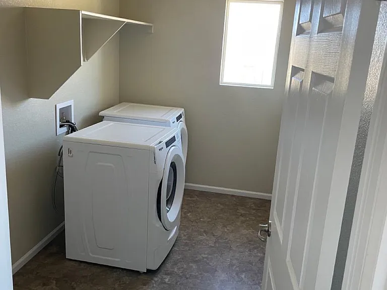 Laundry room with washer and dryer included