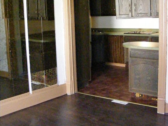 Living room, with kitchen visible