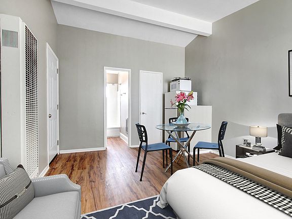 Efficiency no Full Kitchen, White refrigerator and microwave, wood-inspired floors sleeping and dining area