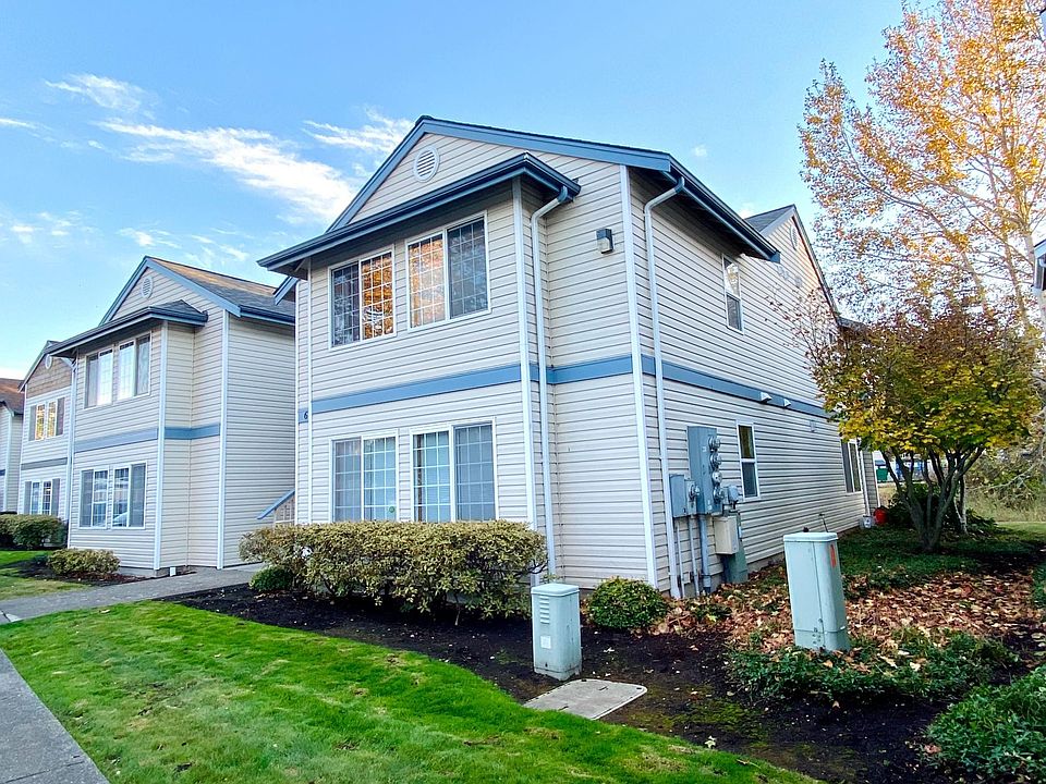 Photo 1 features the outside front of the upper right apartment.