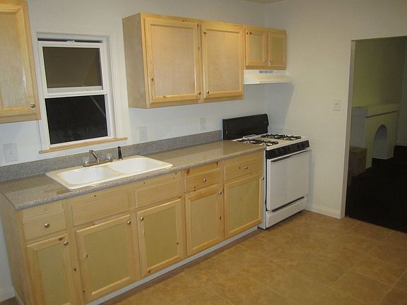 updated kitchen, granite counter, tile floors