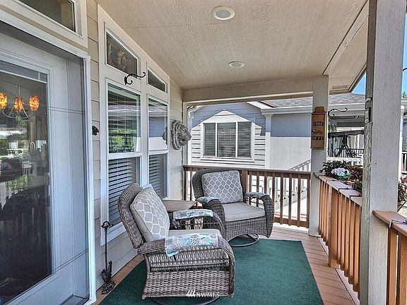The front deck is 8 feet by 27 feet. The home also offers retractable phantom screen doors on each exterior door.  >