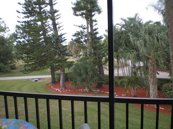 view of golf course and entrance