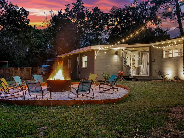 Backyard is great to relax and entertain. Large fire pit, string lights, hot tub, and hammock stands. Plenty of room for yard games like corn hole, volleyball, and badminton, which are also provided.