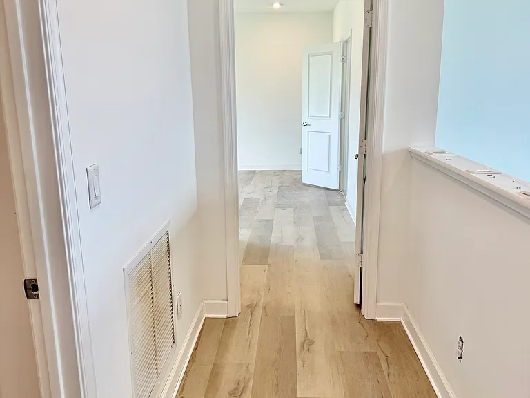 upstairs hallway leading to primary bedroom