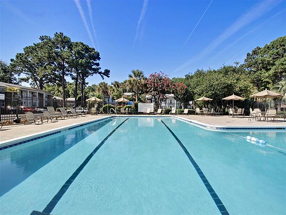 Sparkling swimming pool with lap lanes and sundeck