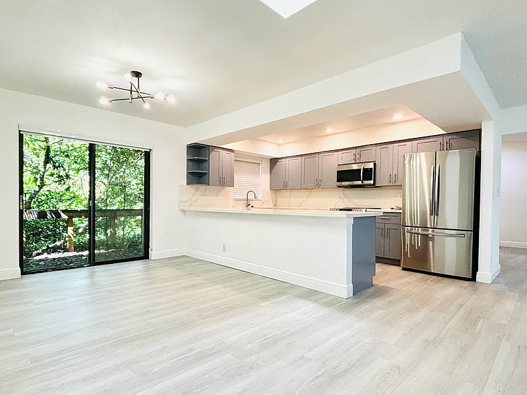 Open Kitchen. French door to backyard.