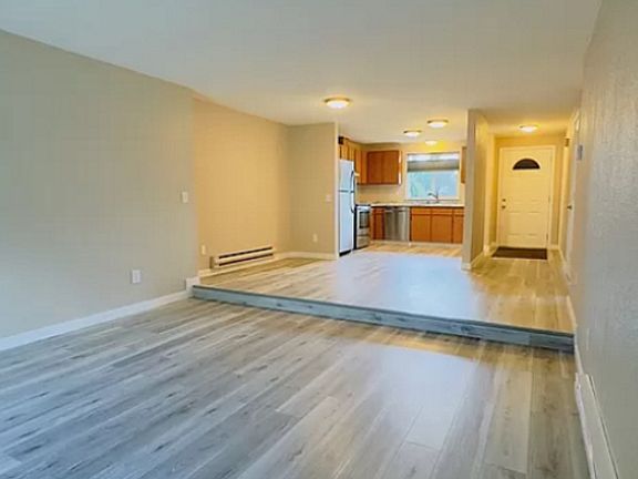 Living area, kitchen, and front door