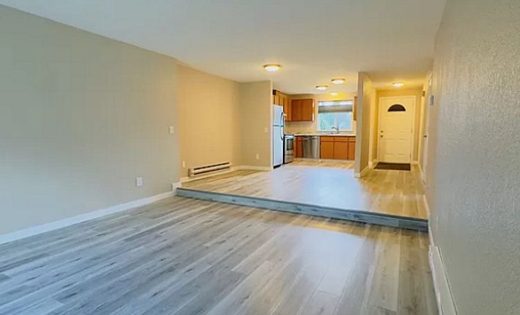 Living area, kitchen, and front door