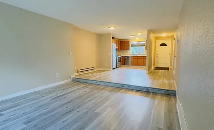 Living area, kitchen, and front door