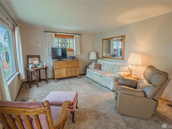 Spacious living room with large windows for natural light.