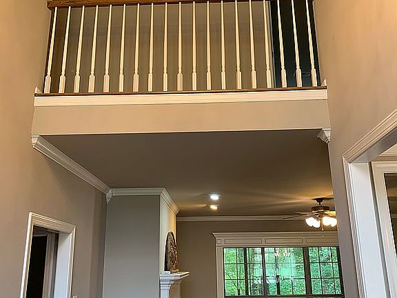 Foyer opening to den