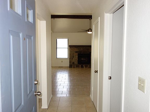 Walking in the front door. Laundry room and garage thru door on the right. Doorway on left leads to full bath and front bedroom. Straight ahead to the living room.