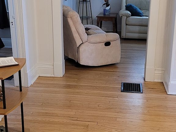 Dining room into Living room from Kitchen doorway, bedrooms to left off Dining Room