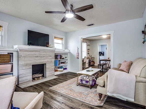 built in bookshelves, faux fireplace, great den