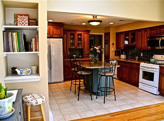 Sun Room, with built-ins and new skylights looking toward kitchen...