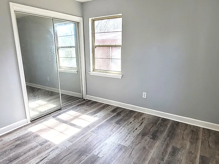 Bedroom #2, fully remodeled with plenty of natural light