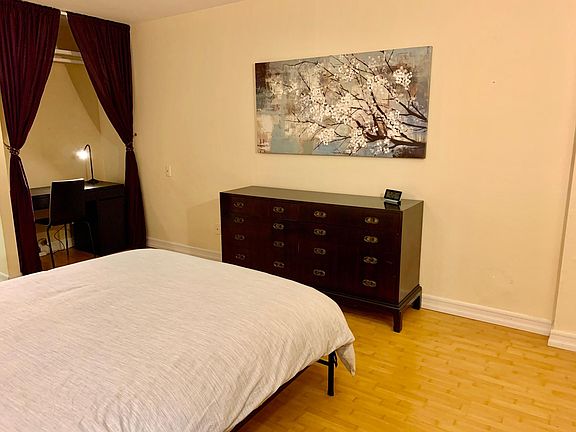 Primary Bedroom, furnished with office nook. Lots of storage space.