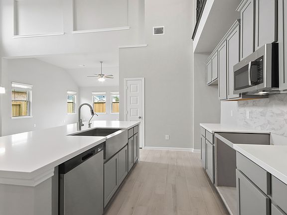 Charming kitchen with two-story ceiling