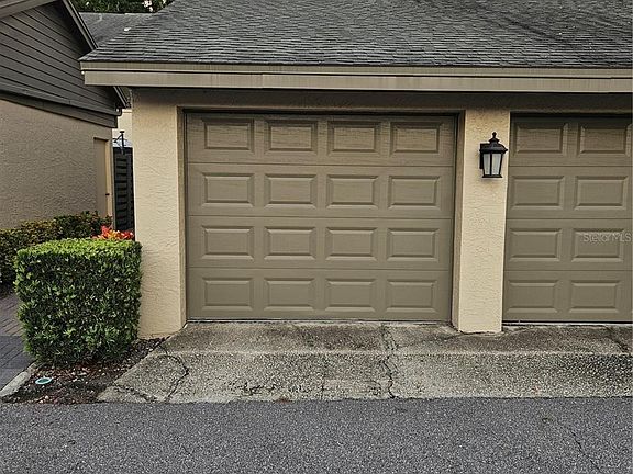 One car garage - side door locks and leads to the stairs.