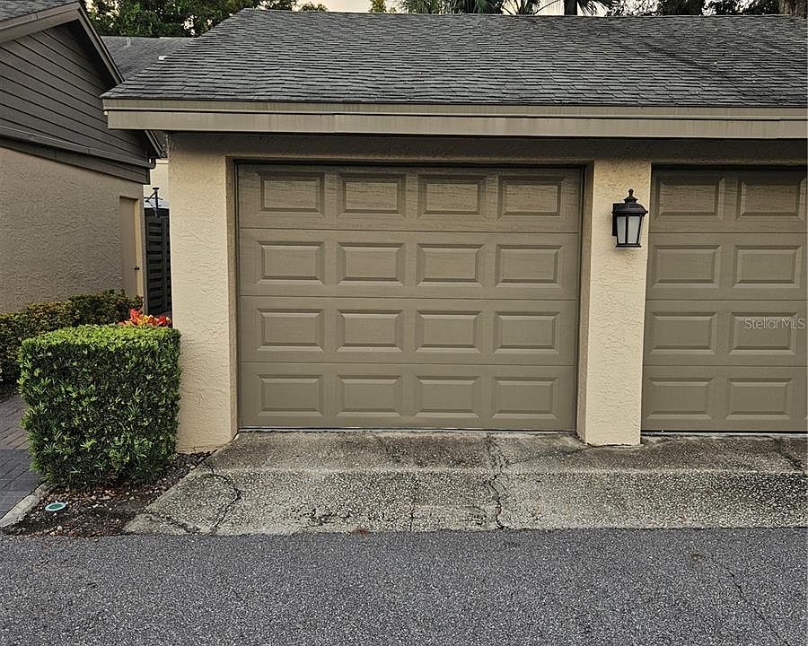 One car garage - side door locks and leads to the stairs.